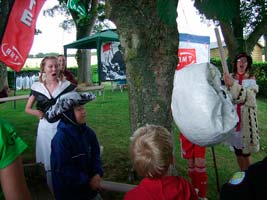 Kids hitting the alram clock piñata