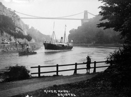 A steamer with a steam tug under Clifton Suspension Bridge. 